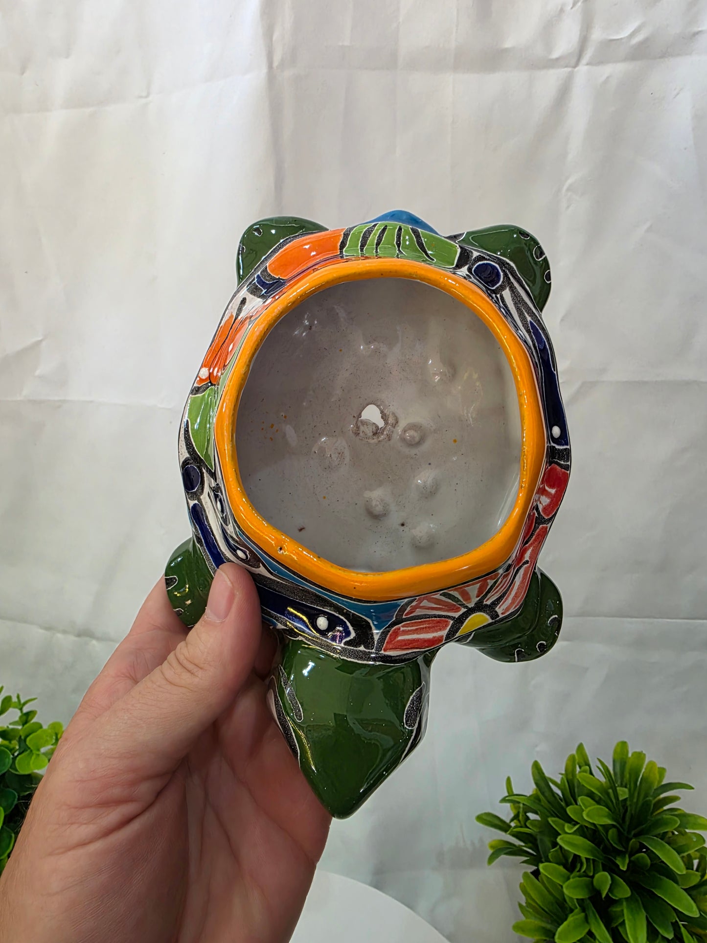 top of a green talavera turtle planter