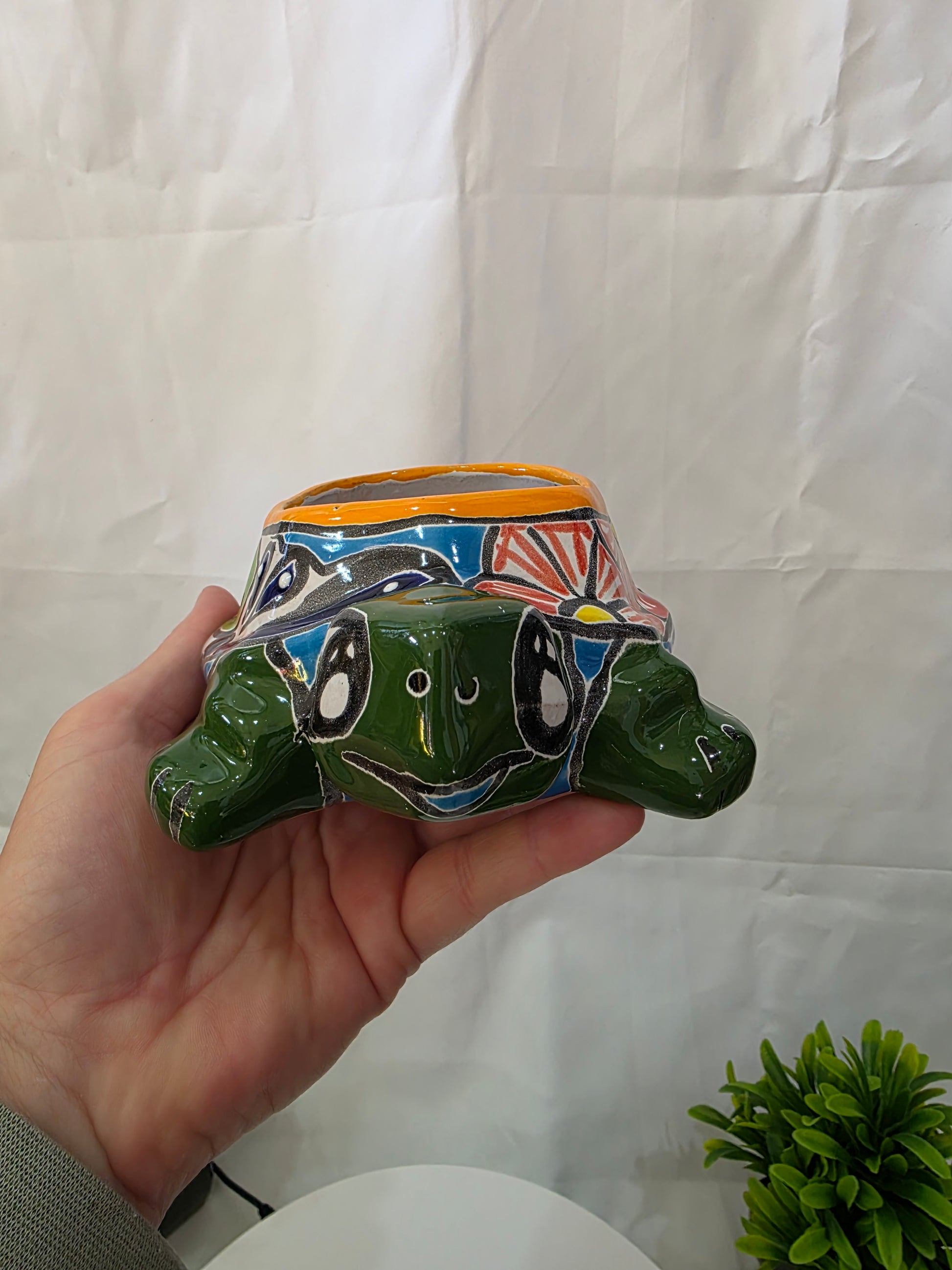 smiling turtle face of green talavera turtle planter
