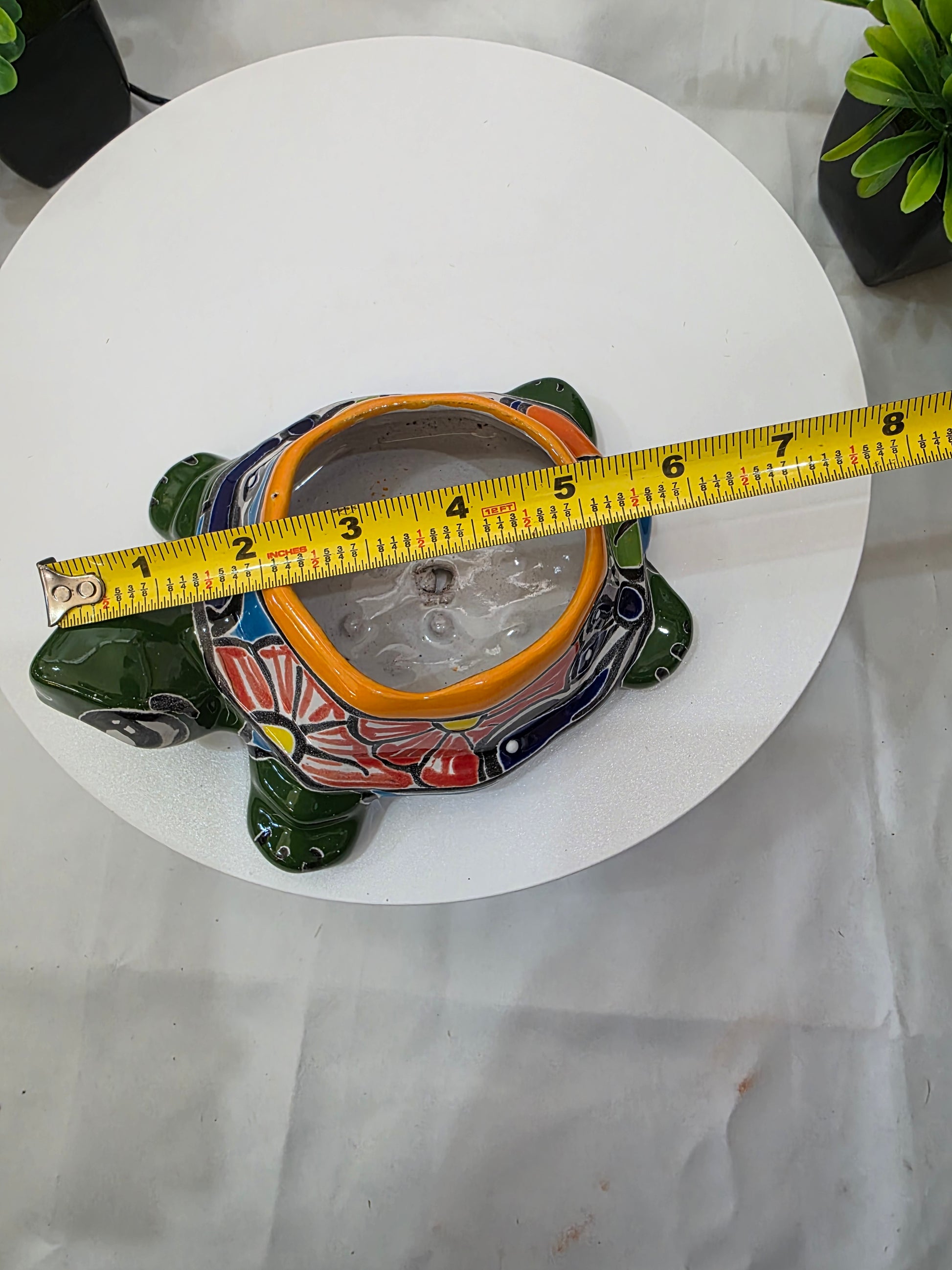 green talavera turtle planter 6 inches long with a tape measure