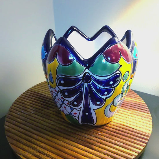 lotus planter on a wood shelf spinning to show all sides, hand painted talavera