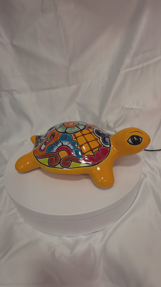 orange talavera turtle on a turntable