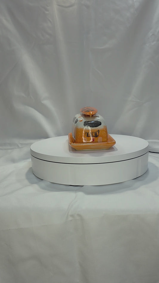 orange vw bus butterdish on a turntable