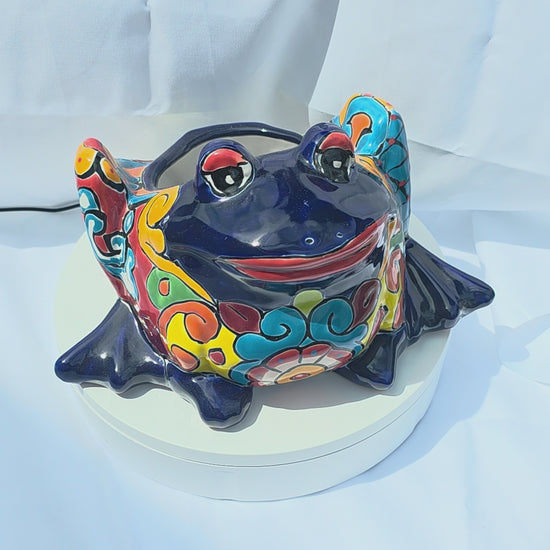  A bright blue hand-painted Mexican frog planter