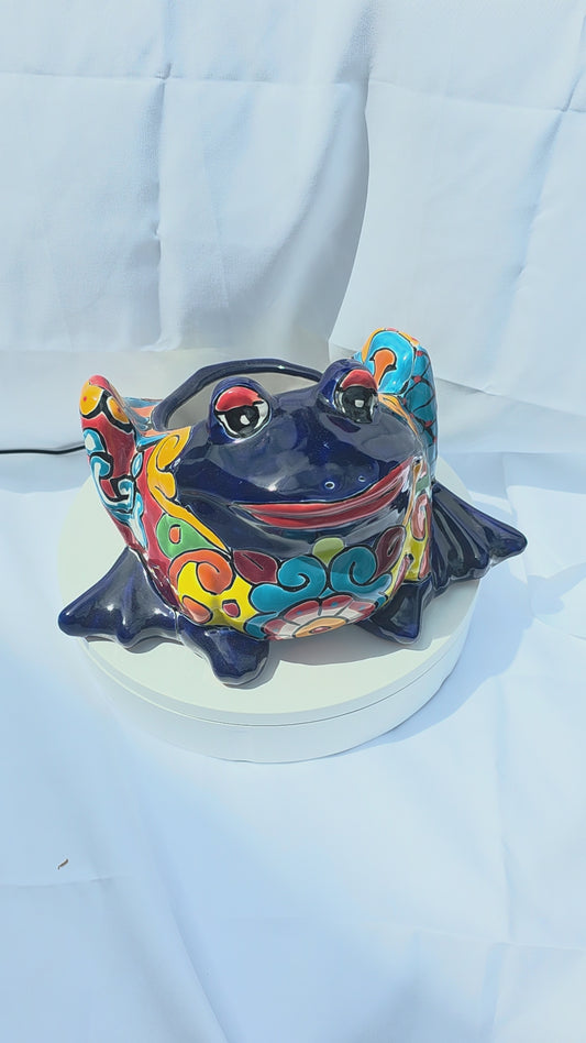  A bright blue hand-painted Mexican frog planter